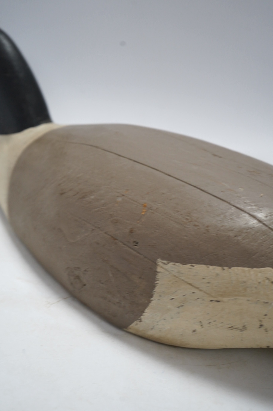 A vintage carved and painted wood decoy goose, 80cm in length. Condition - fair